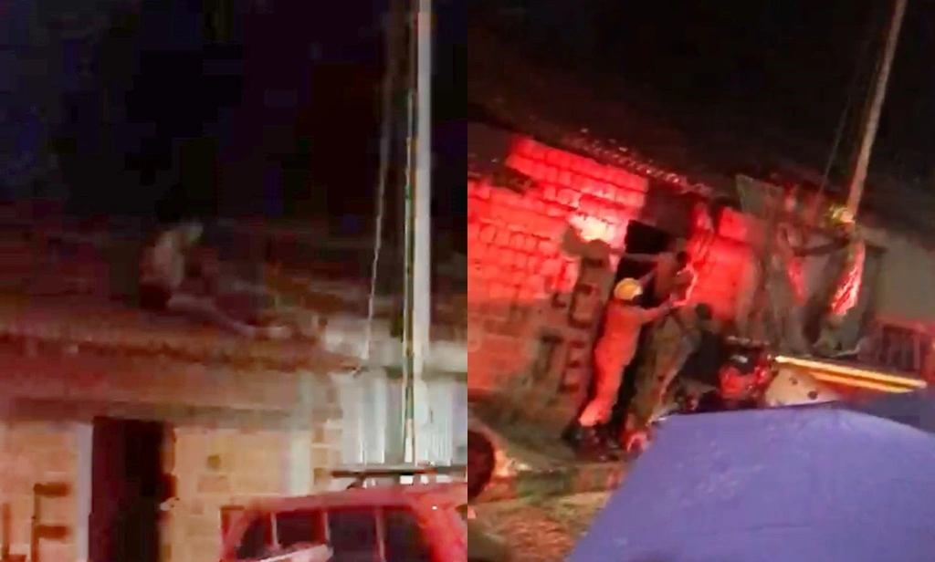 Homem baleado é retirado de telhado de residência