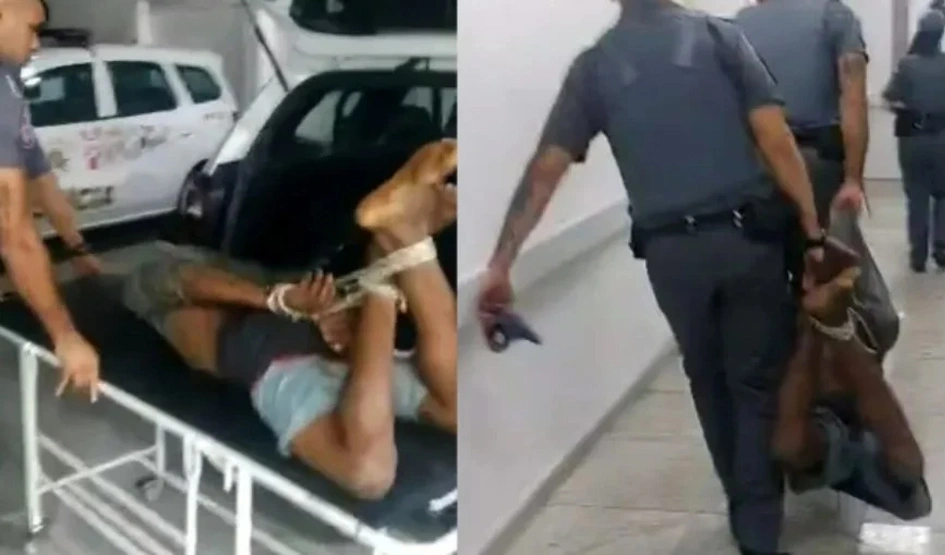 Suspeito é amarrado e carregado por PMs