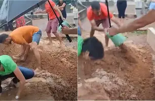 Debaixo de chuva, netos usam as mãos para enterrar avó no Tocantins (Foto: Reprodução)