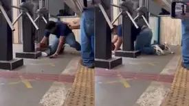 Estudante se arrasta por debaixo do portão e entra antes do fechamento em Cuiabá (Foto: Reprodução)